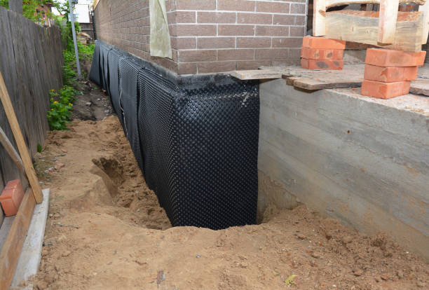 Happy homeowners after waterproofing job in Cockeysville